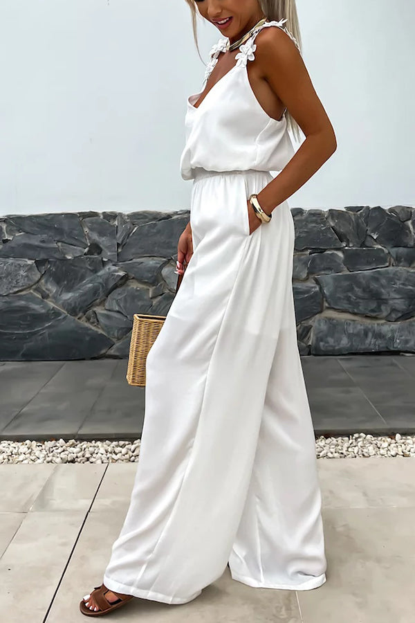 Summer Jumpsuit loose with embroidered flowers and plain straps for an elegant and comfortable style